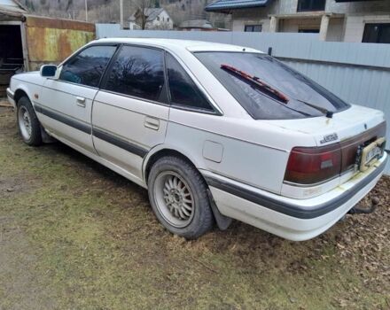 Белый Мазда 626, объемом двигателя 2 л и пробегом 300 тыс. км за 300 $, фото 1 на Automoto.ua