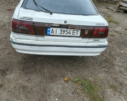 Белый Мазда 626, объемом двигателя 2 л и пробегом 300 тыс. км за 656 $, фото 3 на Automoto.ua