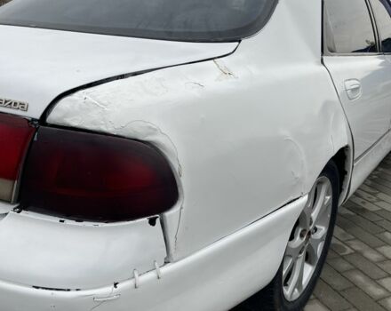 Белый Мазда 626, объемом двигателя 2 л и пробегом 300 тыс. км за 1099 $, фото 3 на Automoto.ua