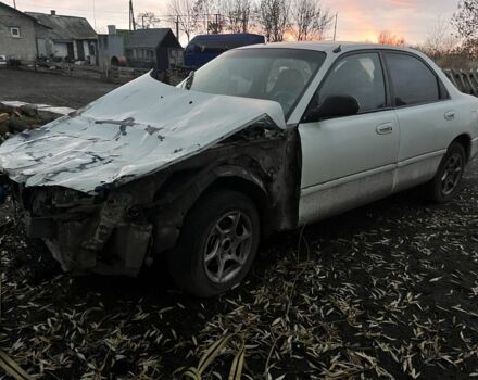 Белый Мазда 626, объемом двигателя 1.8 л и пробегом 300 тыс. км за 1027 $, фото 1 на Automoto.ua