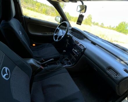 Білий Мазда 626, об'ємом двигуна 1.8 л та пробігом 303 тис. км за 1500 $, фото 9 на Automoto.ua