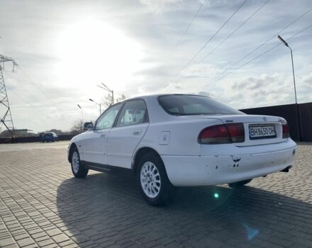 Белый Мазда 626, объемом двигателя 2 л и пробегом 150 тыс. км за 1200 $, фото 2 на Automoto.ua