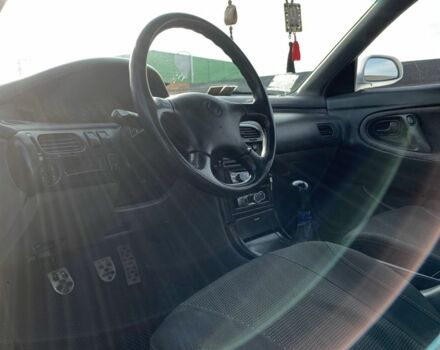 Белый Мазда 626, объемом двигателя 2 л и пробегом 150 тыс. км за 1200 $, фото 4 на Automoto.ua