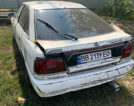 Белый Мазда 626, объемом двигателя 2 л и пробегом 300 тыс. км за 523 $, фото 3 на Automoto.ua