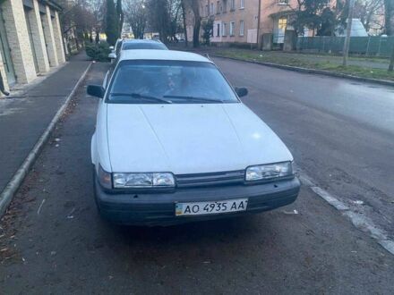 Белый Мазда 626, объемом двигателя 1.8 л и пробегом 250 тыс. км за 600 $, фото 1 на Automoto.ua