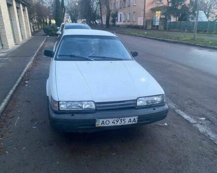 Белый Мазда 626, объемом двигателя 2 л и пробегом 250 тыс. км за 600 $, фото 1 на Automoto.ua