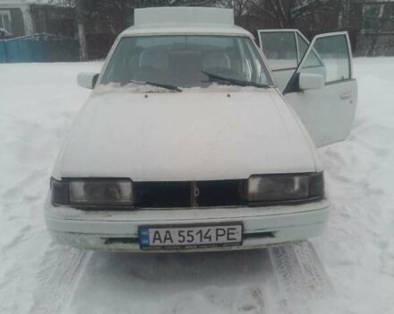 Белый Мазда 626, объемом двигателя 2 л и пробегом 300 тыс. км за 509 $, фото 1 на Automoto.ua