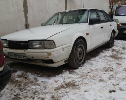 Белый Мазда 626, объемом двигателя 2 л и пробегом 350 тыс. км за 356 $, фото 1 на Automoto.ua