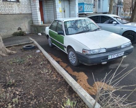 Белый Мазда 626, объемом двигателя 2 л и пробегом 270 тыс. км за 450 $, фото 1 на Automoto.ua
