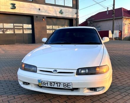 Белый Мазда 626, объемом двигателя 1.8 л и пробегом 300 тыс. км за 2100 $, фото 1 на Automoto.ua