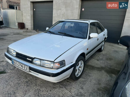 Белый Мазда 626, объемом двигателя 2 л и пробегом 211 тыс. км за 1250 $, фото 1 на Automoto.ua