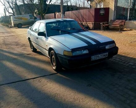 Белый Мазда 626, объемом двигателя 2 л и пробегом 123 тыс. км за 850 $, фото 1 на Automoto.ua