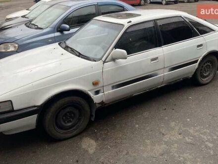 Белый Мазда 626, объемом двигателя 2 л и пробегом 400 тыс. км за 600 $, фото 1 на Automoto.ua