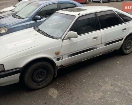 Белый Мазда 626, объемом двигателя 2 л и пробегом 400 тыс. км за 600 $, фото 1 на Automoto.ua