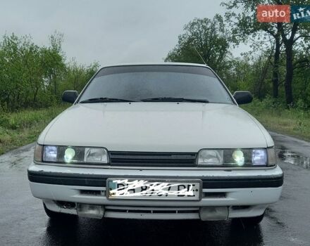 Белый Мазда 626, объемом двигателя 2 л и пробегом 307 тыс. км за 1500 $, фото 1 на Automoto.ua