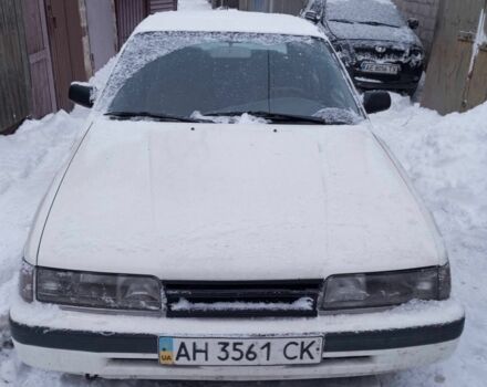 Белый Мазда 626, объемом двигателя 2 л и пробегом 200 тыс. км за 927 $, фото 1 на Automoto.ua