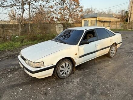 Білий Мазда 626, об'ємом двигуна 2 л та пробігом 225 тис. км за 1100 $, фото 1 на Automoto.ua