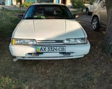 Белый Мазда 626, объемом двигателя 2 л и пробегом 280 тыс. км за 671 $, фото 1 на Automoto.ua