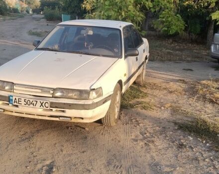 Белый Мазда 626, объемом двигателя 2 л и пробегом 2 тыс. км за 749 $, фото 1 на Automoto.ua