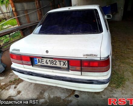 Белый Мазда 626, объемом двигателя 2 л и пробегом 435 тыс. км за 500 $, фото 1 на Automoto.ua