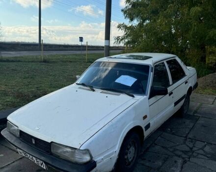 Белый Мазда 626, объемом двигателя 2 л и пробегом 200 тыс. км за 345 $, фото 1 на Automoto.ua