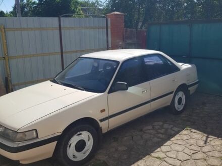 Белый Мазда 626, объемом двигателя 2 л и пробегом 250 тыс. км за 904 $, фото 1 на Automoto.ua