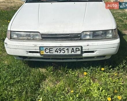 Белый Мазда 626, объемом двигателя 2 л и пробегом 352 тыс. км за 1025 $, фото 1 на Automoto.ua