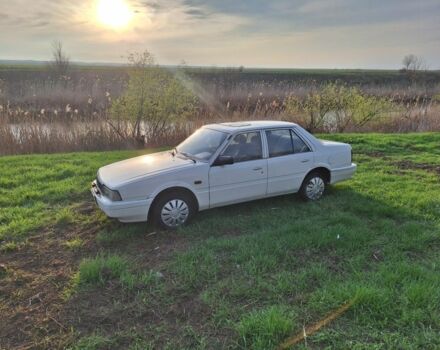 Белый Мазда 626, объемом двигателя 2 л и пробегом 100 тыс. км за 1467 $, фото 1 на Automoto.ua