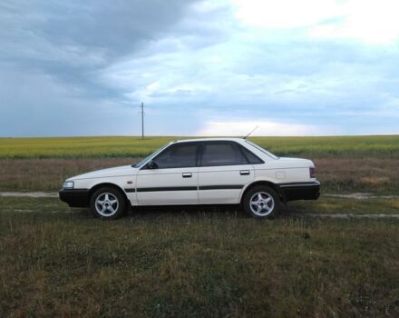 Білий Мазда 626, об'ємом двигуна 1.8 л та пробігом 246 тис. км за 2100 $, фото 1 на Automoto.ua