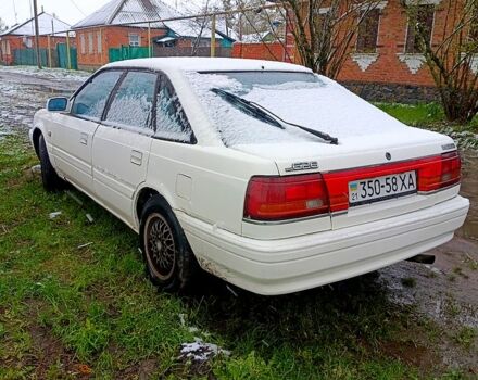 Белый Мазда 626, объемом двигателя 2 л и пробегом 350 тыс. км за 1100 $, фото 1 на Automoto.ua