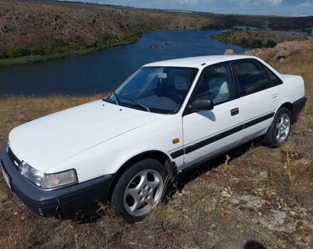 Белый Мазда 626, объемом двигателя 2 л и пробегом 346 тыс. км за 897 $, фото 1 на Automoto.ua