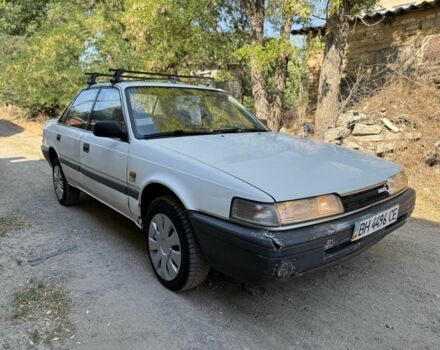 Белый Мазда 626, объемом двигателя 1.6 л и пробегом 100 тыс. км за 650 $, фото 1 на Automoto.ua