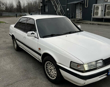 Белый Мазда 626, объемом двигателя 2 л и пробегом 412 тыс. км за 2500 $, фото 1 на Automoto.ua