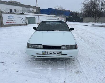 Белый Мазда 626, объемом двигателя 2 л и пробегом 330 тыс. км за 1300 $, фото 1 на Automoto.ua