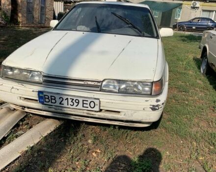 Белый Мазда 626, объемом двигателя 2 л и пробегом 300 тыс. км за 523 $, фото 1 на Automoto.ua