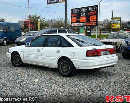 Белый Мазда 626, объемом двигателя 2 л и пробегом 300 тыс. км за 699 $, фото 1 на Automoto.ua