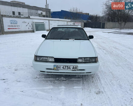 Белый Мазда 626, объемом двигателя 2 л и пробегом 330 тыс. км за 1500 $, фото 1 на Automoto.ua