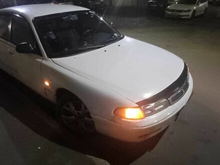 Белый Мазда 626, объемом двигателя 2 л и пробегом 306 тыс. км за 1200 $, фото 1 на Automoto.ua