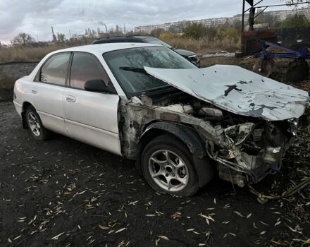 Белый Мазда 626, объемом двигателя 1.8 л и пробегом 300 тыс. км за 1027 $, фото 1 на Automoto.ua