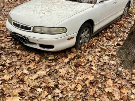 Белый Мазда 626, объемом двигателя 2.5 л и пробегом 327 тыс. км за 300 $, фото 1 на Automoto.ua