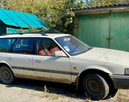 Белый Мазда 626, объемом двигателя 2 л и пробегом 194 тыс. км за 1300 $, фото 1 на Automoto.ua
