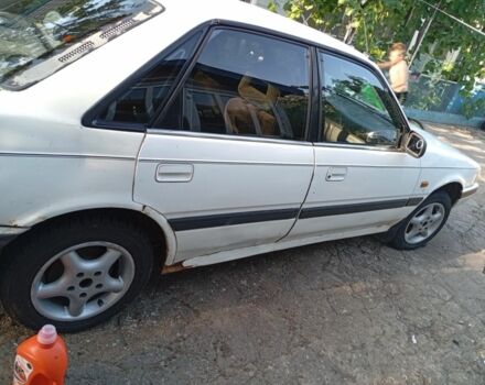 Бежевый Мазда 626, объемом двигателя 2 л и пробегом 200 тыс. км за 850 $, фото 2 на Automoto.ua