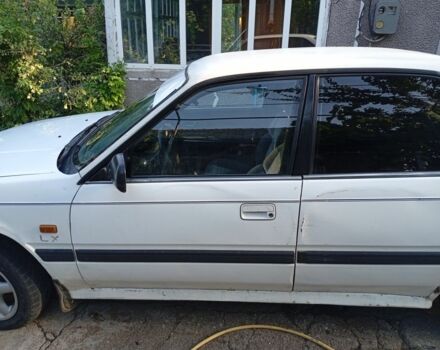 Бежевый Мазда 626, объемом двигателя 2 л и пробегом 200 тыс. км за 850 $, фото 4 на Automoto.ua