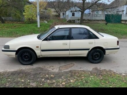 Бежевый Мазда 626, объемом двигателя 2 л и пробегом 210 тыс. км за 1800 $, фото 1 на Automoto.ua