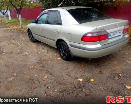 Бежевый Мазда 626, объемом двигателя 2 л и пробегом 277 тыс. км за 2450 $, фото 1 на Automoto.ua