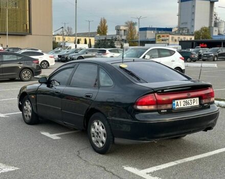 Черный Мазда 626, объемом двигателя 2.5 л и пробегом 483 тыс. км за 1200 $, фото 3 на Automoto.ua