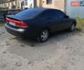 Черный Мазда 626, объемом двигателя 2 л и пробегом 400 тыс. км за 1800 $, фото 1 на Automoto.ua