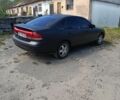 Черный Мазда 626, объемом двигателя 2 л и пробегом 400 тыс. км за 1500 $, фото 1 на Automoto.ua