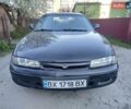 Черный Мазда 626, объемом двигателя 2 л и пробегом 370 тыс. км за 1150 $, фото 1 на Automoto.ua