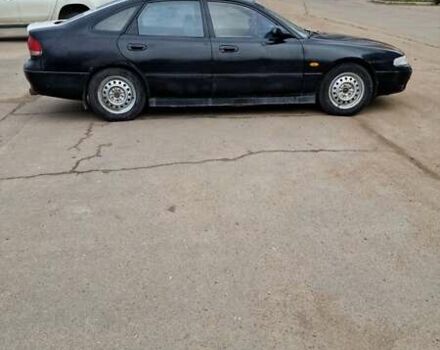 Черный Мазда 626, объемом двигателя 2.5 л и пробегом 380 тыс. км за 1500 $, фото 7 на Automoto.ua